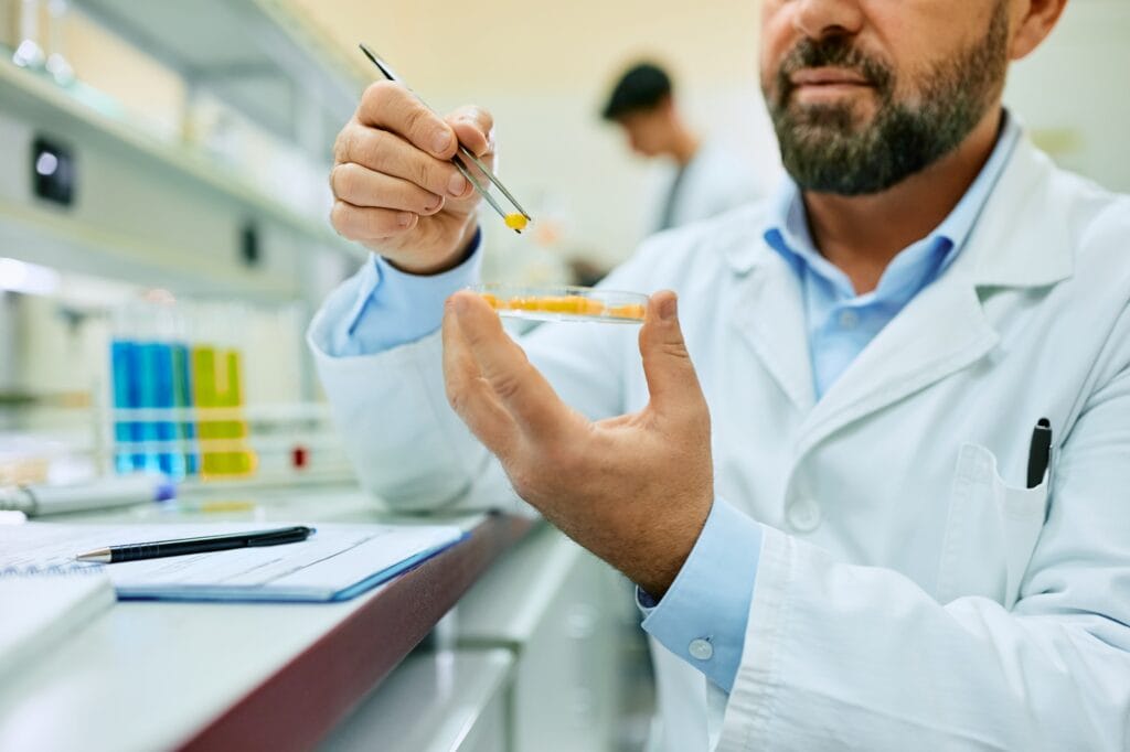 Close up of scientist working in pharmaceutical laboratory.